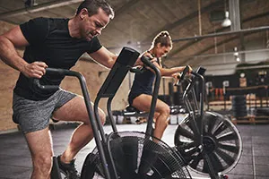 A Couple On Exercise Bikes