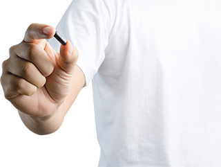 man holding a single activated charcoal 2000mg capsules man holding a single activated charcoal 2000mg capsules