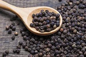 black pepper spreaded out of a spoon