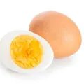 Boiled egg with a boiled egg infront showing half cut yolk and whites