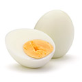 Boiled egg with a boiled egg infront showing half cut yolk and whites Boiled egg with a boiled egg infront showing half cut yolk and whites