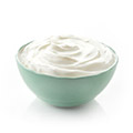 Green bowl containg hunger suppressing greek yogurt