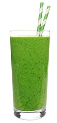 glass of a smoothie made from spirulina powder with ingredients