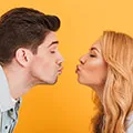 man and woman about to kiss withough touchinng to stop spread of germs