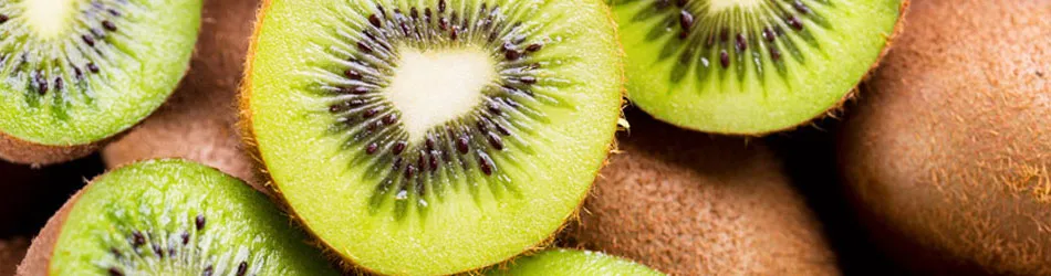 kiwis next to each other with half cut kiwis on top