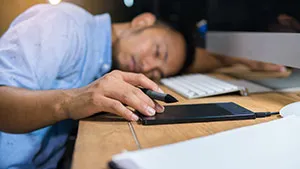 Man FAllen Asleep At His Desk