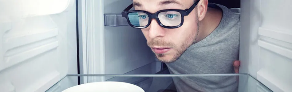 Man Looking Inside Fridge