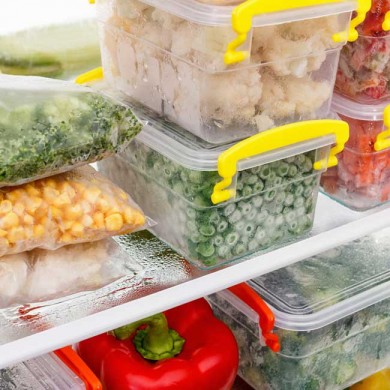 food in containers and tubs in the fridge to represent meal prep