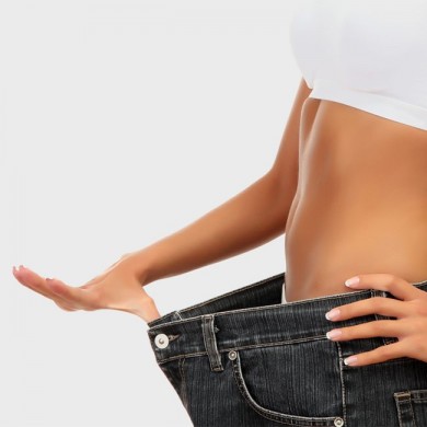 image of woman with skinny waist and oversized jeans