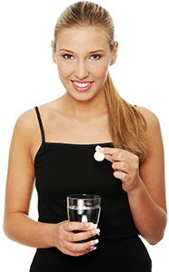 Woman taking a proto-col bronze supplement showing how to use Woman taking a proto-col bronze supplement showing how to use
