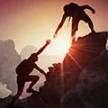 image of two people climing a rock face together to show togetherness