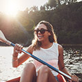 image of two girls having fun whilst rowing a boat
