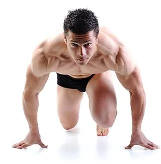 Man with Muscles Ready to Sprint to show muscle support powder