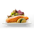 salmon fillet with lemons and vegetables, to show that fish promotes muscle growth