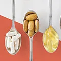 image of spoons holding softgels capsules and tablets