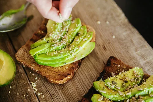 image of a slice of toast with avacado to show brown bread