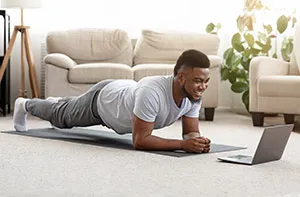 training-home-sporty-man-doing-yoga