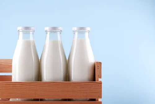 three bottles of milk to represent whole skimmed and semi skimmed milk