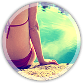 woman sitting on a rock next to the water to show calmness woman sitting on a rock next to the water to show calmness