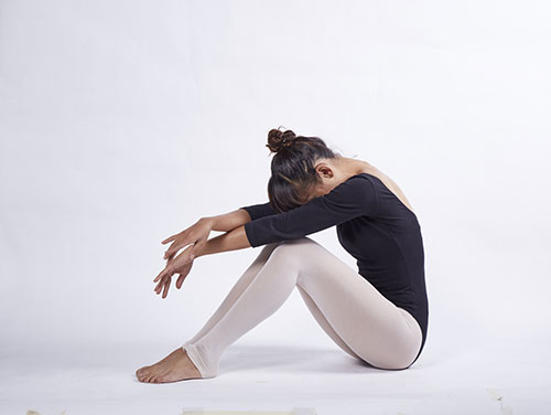 image of woman doing yoga which is exercise number 3
