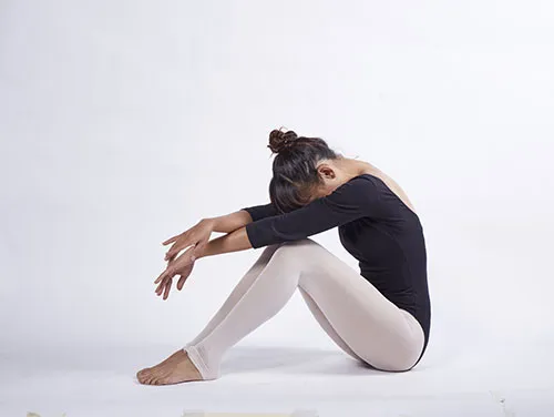image of woman doing yoga which is exercise number 3