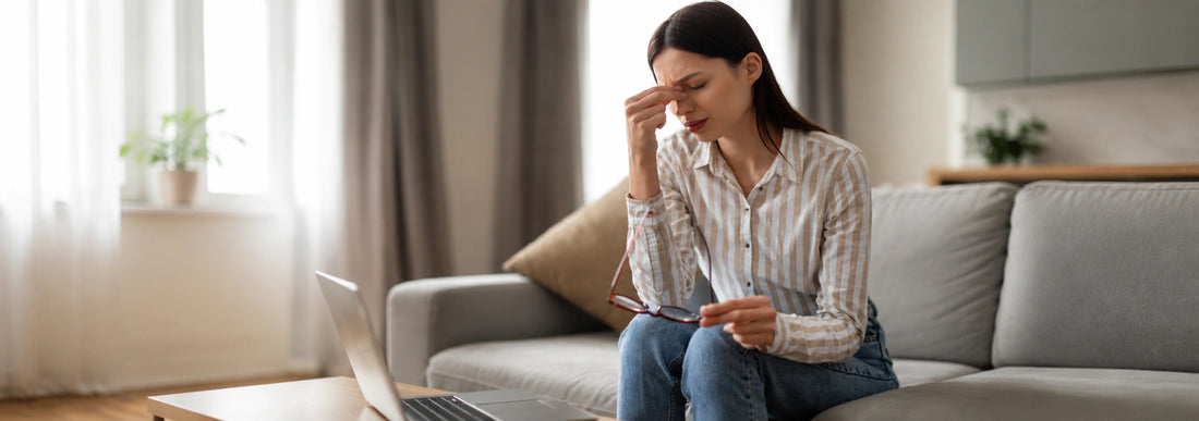 Woman showing signs of fatigue and tiredness, potentially indicating magnesium deficiency symptoms
